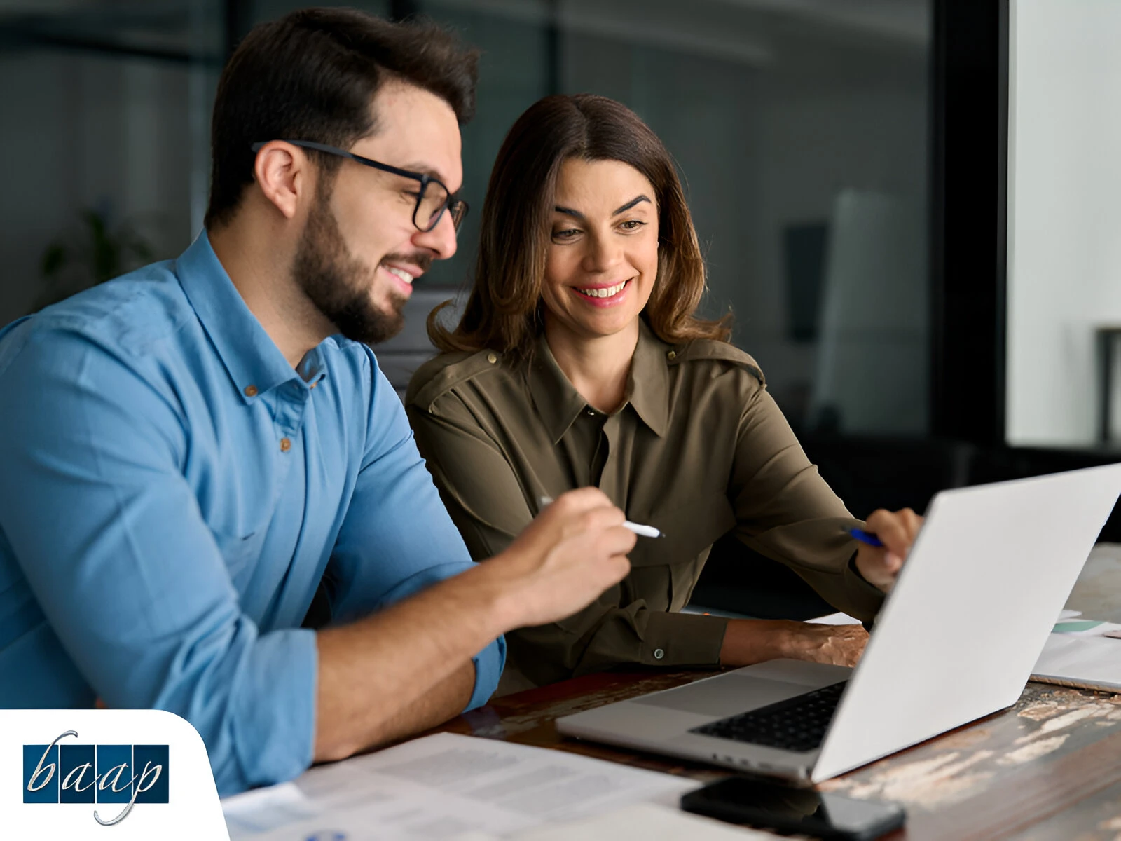 Small business owners reviewing tax strategy with advisor